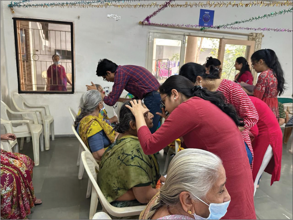 The faculties and trainees performing glaucoma screening tests at old age home.